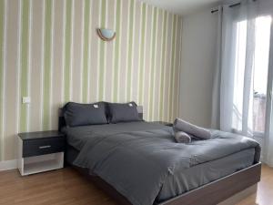 Posteľ alebo postele v izbe v ubytovaní Entier Big Appartement
