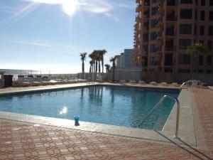 a swimming pool with a blue ball in the middle at SunSwept 505 by ALBVR - Beachfront condo at a great location! in Orange Beach