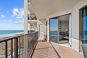 a balcony with a view of the ocean at Phoenix VII 71113 by ALBVR - Beautiful Beachfront Condo with Amazing Views & Amenities! in Orange Beach
