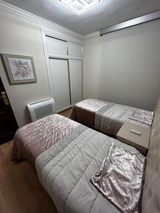 a room with two beds in a room at Sea-side Villa in la Zenia in Alicante