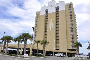 a large building with palm trees in a parking lot at Island Royale P403 by ALBVR - Beautiful Beachfront Penthouse Level Condo! in Gulf Shores
