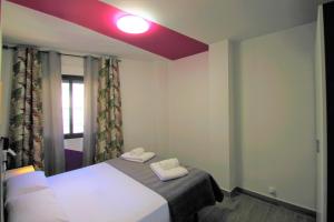 Posteľ alebo postele v izbe v ubytovaní CASATURIS NEWON APARTAMENTOS en EL CAMPELLO