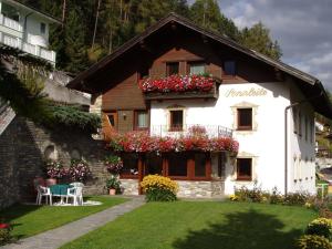a house with flowers on the side of it at Haus Sonnleite in Trins