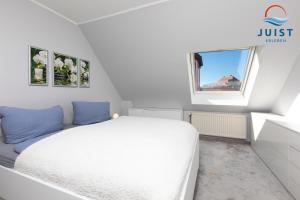 Postel nebo postele na pokoji v ubytování Haus Hahntje 192 - Wohnung Sonnenwinkel