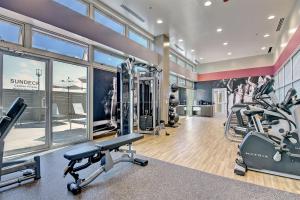 a gym with treadmills and elliptical machines at Tulsa Marriott Southern Hills in Tulsa