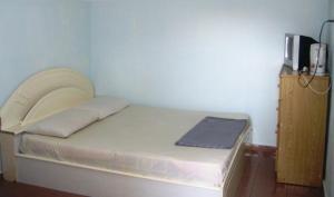 A bed or beds in a room at ET Budget Guest House