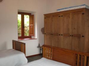 Postel nebo postele na pokoji v ubytování Casa Rural Las Caldereras