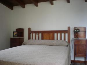 Postel nebo postele na pokoji v ubytování Casa Rural Las Caldereras