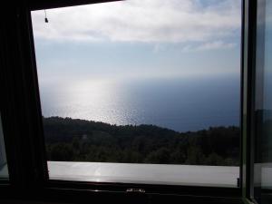a view of the ocean from a window at Porto Katsiki Blu in Athani