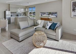 a living room with a couch and a table at Salt 19 Sorrento Luxury by the beach in Sorrento