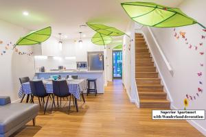 a dining room with green umbrellas hanging from the ceiling at Chapel Heights Apartments in New Lambton