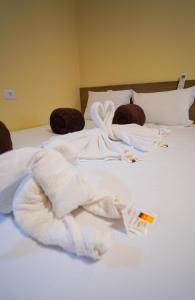 a bed with white towels on top of it at Verdant hotel in Bonito