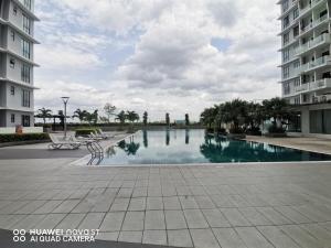 a swimming pool in the middle of a building at Platino Aparment @ Paradigm Mall in Johor Bahru