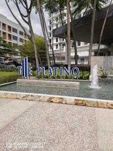 a sign in front of a building with a fountain at Platino Aparment @ Paradigm Mall in Johor Bahru +22 photos