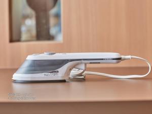 a iron sitting on top of a table at First Cabin Nishi Umeda in Osaka