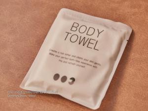 a white bag with the words body tower on it at First Cabin Nishi Umeda in Osaka