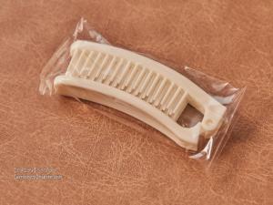 a white tooth brush in a plastic bag at First Cabin Nishi Umeda in Osaka