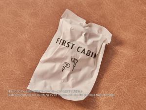 a white bag with the words first cabinritten on it at First Cabin Nishi Umeda in Osaka