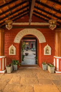 an entry way to a building with an archway at Sawantwadi Palace Boutique Art Hotel in Sawantwadi
