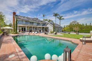 a home with a swimming pool and a house at Stunning Home in Orange County with Stables! in Orange