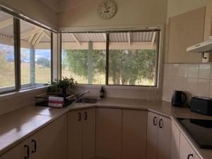 Køkken eller tekøkken på Baringa Cottage + 6 billeder