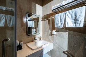 a bathroom with a sink and a mirror at LeeVi Homestay - Coffee - Milktea in Phu Quoc +77 photos