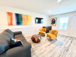 a living room with a couch and two chairs at Saltwater 202 2nd Floor Low Tide in Surf City