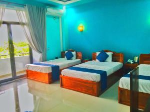 SP Tourist Hotel Jaffna客房内的一张或多张床位
