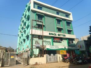 a green building with a space center sign on it at HOTEL SPACE SETTER in Bhubaneshwar