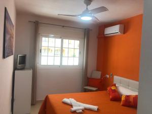 A television and/or entertainment centre at Magnificent Apartment Mar de Cristal, Pl Baja, Urb private, leisure and swim n01