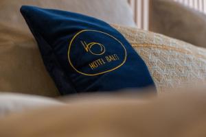 a blue pillow sitting on top of a couch at Hotel Balo in Istanbul