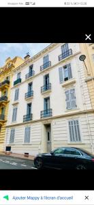 a car parked in front of a large building at Duplex cathédrale in Cannes