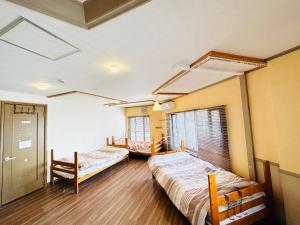 Voodi või voodid majutusasutuse DEER Hostel OSAKA NAMBA toas