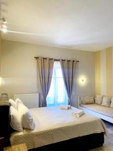 Postel nebo postele na pokoji v ubytování Hermes Hotel