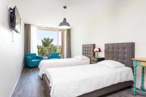 Katil atau katil-katil dalam bilik di Aisa Apartments