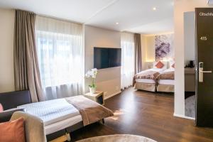 Letto o letti in una camera di Cascada Boutique Hotel