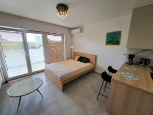 Postel nebo postele na pokoji v ubytování Kima Apartament Bażantów 29