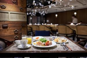 a table with plates of food and drinks on it at Dhawa Yura Kyoto - Banyan Group in Kyoto