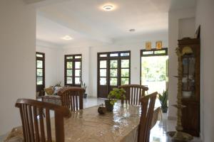 a dining room with a table and some chairs at Kandy Fortress in Kandy