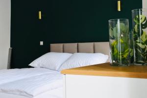 Łóżko lub łóżka w pokoju w obiekcie Narutowicza 5 Apartments