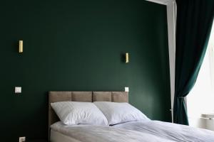 Łóżko lub łóżka w pokoju w obiekcie Narutowicza 5 Apartments
