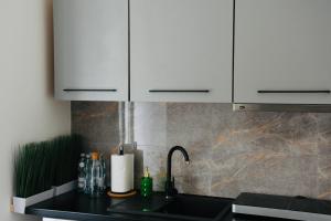 Kuchnia lub aneks kuchenny w obiekcie Narutowicza 5 Apartments