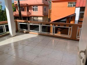 a balcony with a view of some buildings at NR appartments in Curepipe