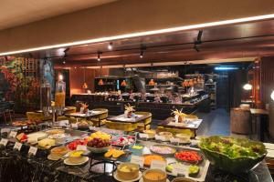 a buffet line with many different types of food at Valia Hotel Bangkok in Bangkok
