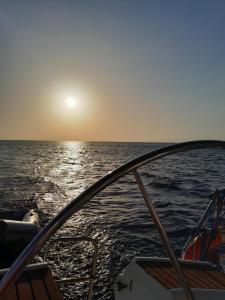 a view from the front of a boat in the ocean at Swing in Corfu Town
