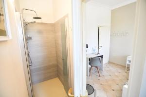 a bathroom with a shower and a desk in a room at B&B Antico Sentiero in Cesena +78 photos
