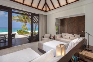 Rúm í herbergi á Heritance Aarah - Premium All Inclusive - Complimentary Stay for 1 Child for Stays between April 2025 to September 2025