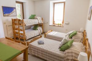 Ένα ή περισσότερα κρεβάτια σε δωμάτιο στο La Gregoriana