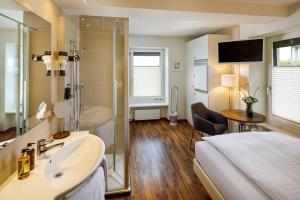 Postel nebo postele na pokoji v ubytování Aparthotel Familie Hugenschmidt