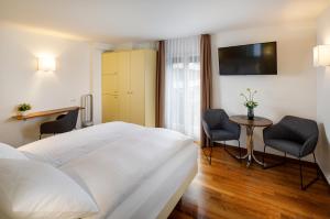 Postel nebo postele na pokoji v ubytování Aparthotel Familie Hugenschmidt